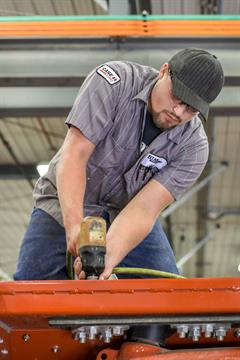 Uptime Ag_Service Technician View Titan Service Technician doing a farm equipment Uptime Inspection
