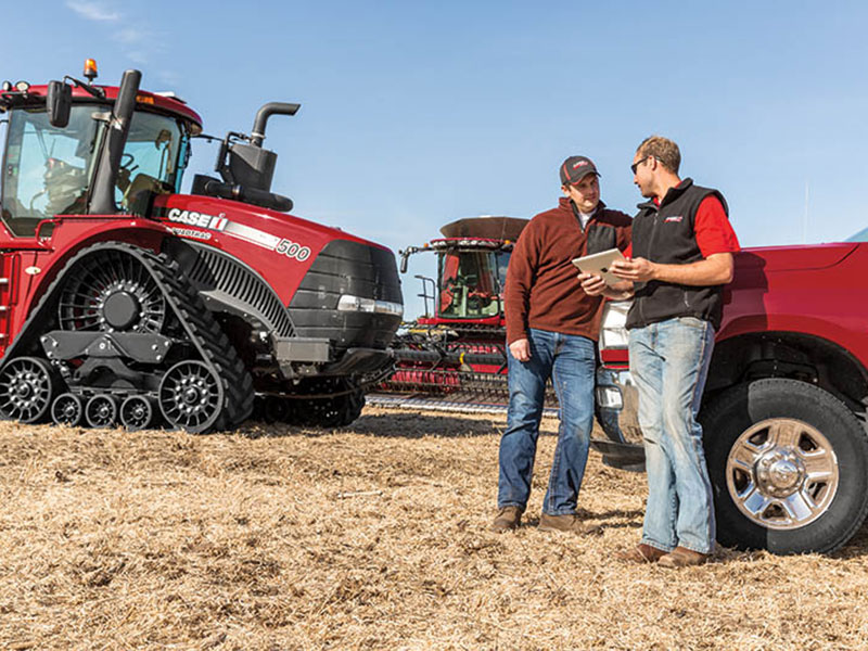 Precision_LP Precision Farming Specialist with customer and Case IH Quadtrac in field