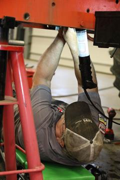 Service Technician - Farm Equipment Uptime Titan Machinery service technician working on an ag uptime inspection