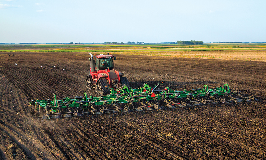 Chisel Plow Summers Tillage Equipment being pulled by a Case IH Tractor