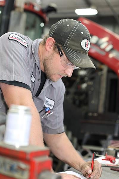 Titan Machinery Service Technician - CNHi Warranty Titan Machinery service tech replacing CNHi genuine parts