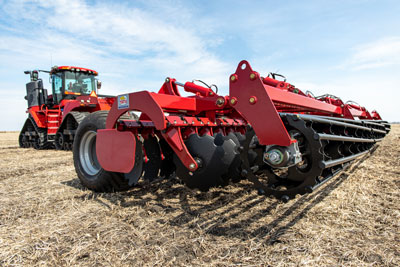 Tatu Speed Disk - Quadtrac Tatu Speed Disk in field with tractor